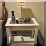 F40. White glass top end table. 